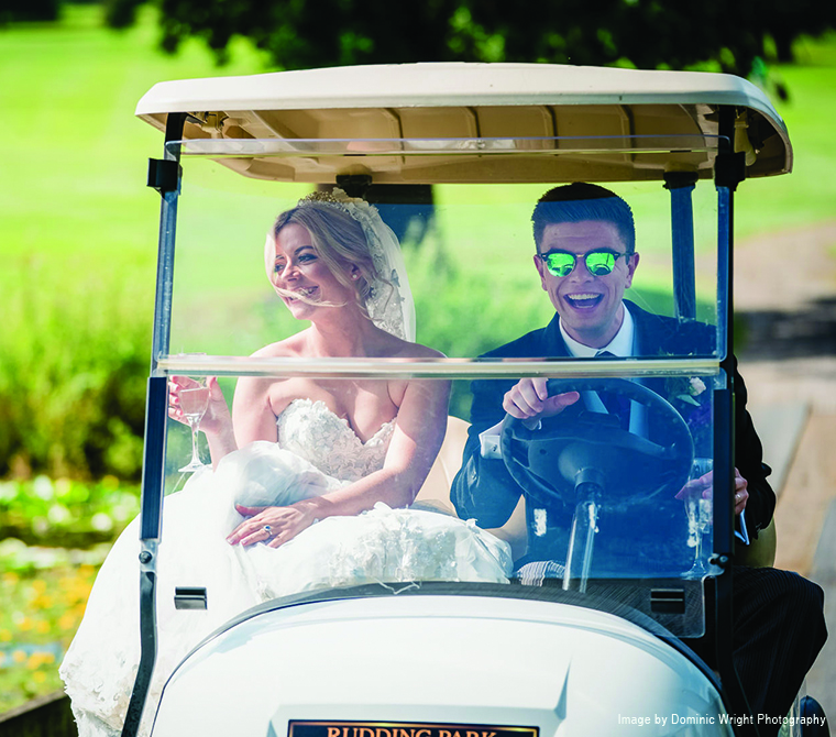 Bride and Groom In A Golf Buggy
